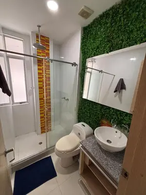 a bathroom with a toilet and a sink and a shower at Refugio junto al mar en el Cabrero in Cartagena de Indias