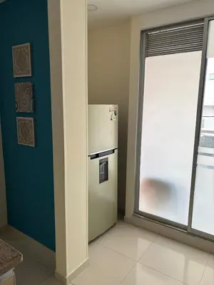 a white refrigerator in a room with a window at Refugio junto al mar en el Cabrero in Cartagena de Indias