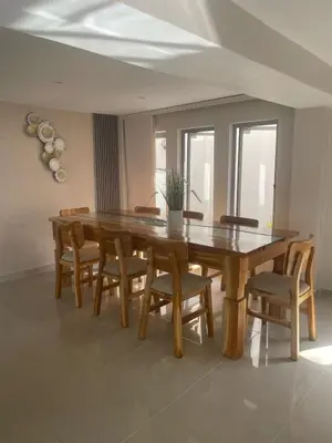 a dining room with a wooden table and chairs at Luxury cabin in Santa Veronica in Santa Veronica