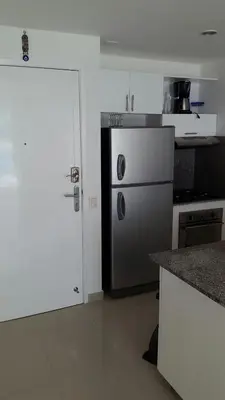 a kitchen with a refrigerator and a counter top at Morros Epic Cartagena in Cartagena de Indias