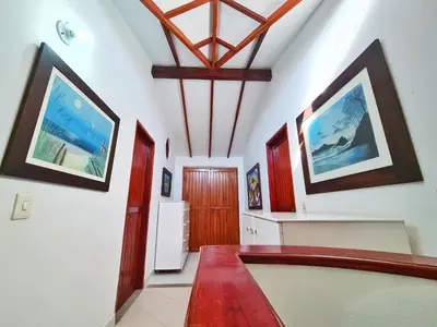 a hallway of a house with white walls and a ceiling at Lujosa cabana con piscina playa y servicio in San Silvestre