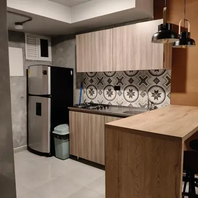 a kitchen with a refrigerator and a counter top at Exclusive apartament near downtown and beach in Cartagena de Indias