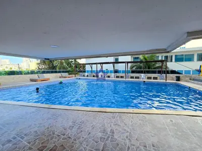 a large swimming pool in a building at Apartamento Confort 13 Vista Caribe in Cartagena de Indias