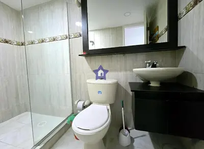 a bathroom with a toilet and a sink at Estudio Sky View - Piso 20 in Cartagena de Indias