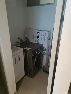 a kitchen with a washing machine and a box at Suite 803 Edif Distrito 90 in Barranquilla