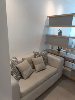 a couch with pillows on it in a living room at Suite 803 Edif Distrito 90 in Barranquilla