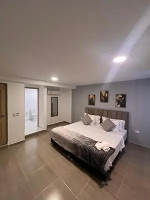 a large bedroom with a large bed in it at Davé Paradise in Cartagena de Indias