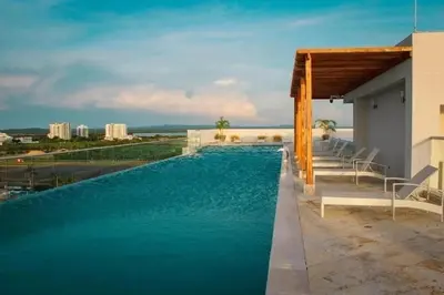 a swimming pool with a view of the water at Escapada 2BR en Ocean Drive in Cartagena de Indias