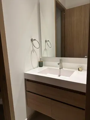 a bathroom with a white sink and a mirror at baia kristal paraiso aguas cristalinas in Cartagena de Indias