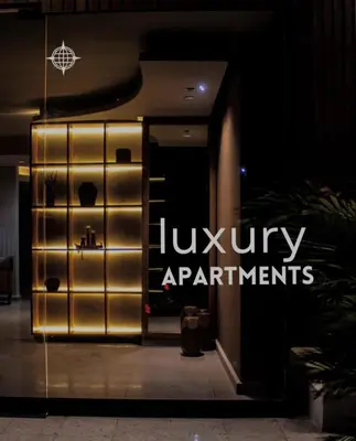 an entrance to a lobby with the luxury apartments sign at Sunset47 in Cartagena de Indias