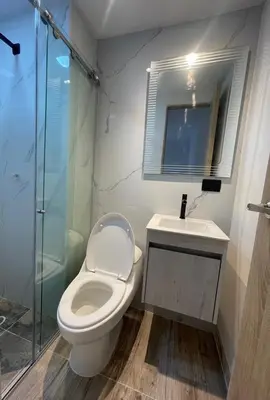a bathroom with a toilet and a sink and a shower at Sunset47 in Cartagena de Indias