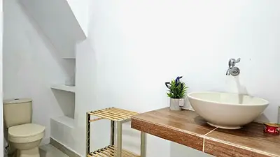 a bathroom with a sink and a toilet at Apartamento cerca a la playa y al mar Punta Roca in Maizal