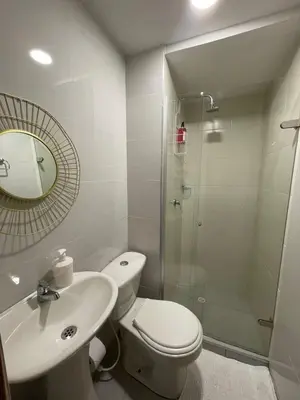 a bathroom with a toilet and a sink and a shower at B lounge experience ctg bolívar in Cartagena de Indias