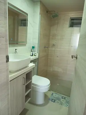 a bathroom with a toilet and a sink and a shower at B lounge experience ctg bolívar in Cartagena de Indias