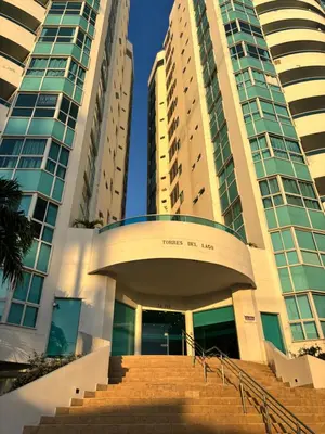 a building with two tall buildings and a staircase at Ocean and Lagoon View Apartment in Cartagena El Laguito 804A in Cartagena de Indias