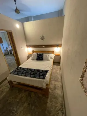 a bedroom with a large bed in a room at Terraza Del Sol in Coveñitas