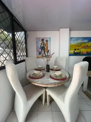 a dining room with a table and chairs at Homethel Studio Apt privado in Cartagena de Indias
