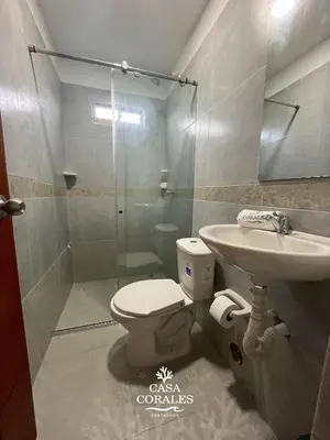 a bathroom with a toilet and a sink at Casa Corales Cartagena in Cartagena de Indias