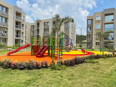a playground in front of a apartment complex at 