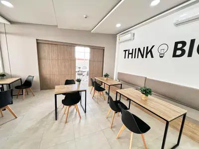a restaurant with tables and chairs in a room at 