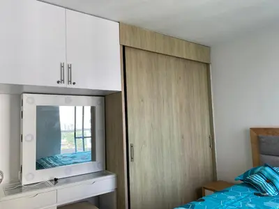 a bedroom with a dresser and a mirror at Amoblado cerca playa Marbella in Cartagena de Indias