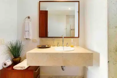 a bathroom with a sink and a mirror at Charming Cartagena Apartment Your Perfect Getaway in Cartagena de Indias