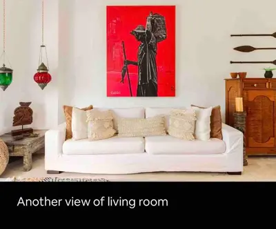 a living room with a white couch and a painting at Charming Cartagena Apartment Your Perfect Getaway in Cartagena de Indias