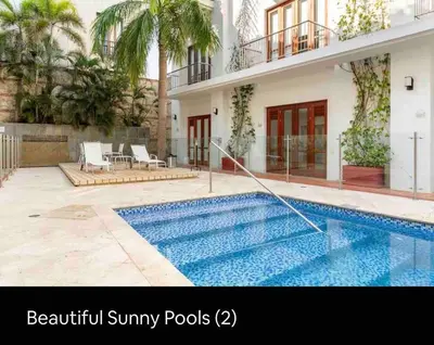 a swimming pool in front of a building at Charming Cartagena Apartment Your Perfect Getaway in Cartagena de Indias