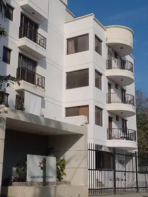 a white building with balconies on the side of it at Bello Horizonte y CC ZAZUE in Santa Marta