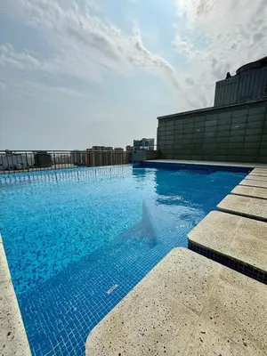 a dolphin swimming in a swimming pool on a building at Apartamento entero amoblado con excelente ubicación en Barranquilla in Barranquilla