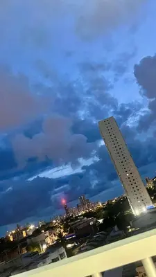 a view of a city skyline at night at Alojamiento cerca del centro histórico y de la playa in Estación El Salto