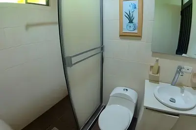 a bathroom with a toilet and a sink at Tu Casa de playa frente al mar, Tolú te espera in Tolú
