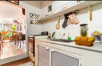 a kitchen with a sink and a counter top at Casa Vilmar Getsemani in Cartagena de Indias