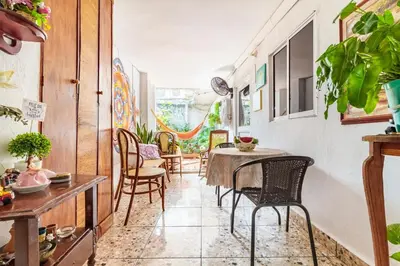 a dining room with a table and chairs at Casa Vilmar Getsemani in Cartagena de Indias