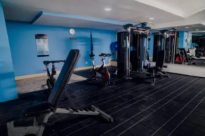 a gym with several treadmills and exercise bikes at Beachfront Condo in Cartagena in Cartagena de Indias