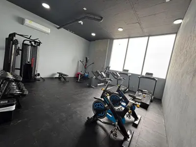 a gym with several tread machines in a room at Premium Hub 1304 APARTAMENTO CARTAGENA Vista al Mar in Cartagena de Indias