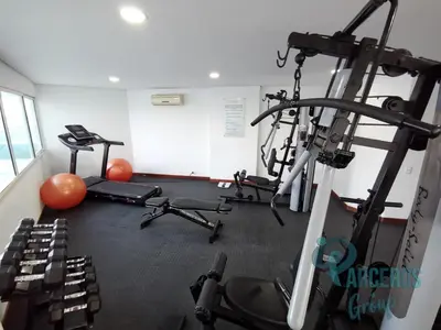 a gym with two treadmills and two machines at Apartamentos Torres Del Lago Por Parceros Group in Cartagena de Indias