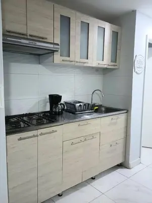 a kitchen with a sink and a stove at Balcon y Vista al Mar in Cartagena de Indias