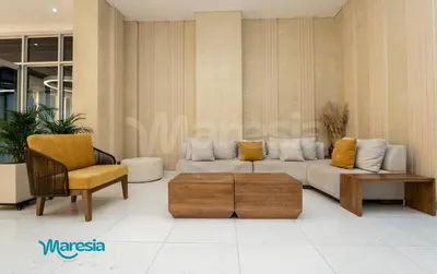 a living room with a couch and a chair at Seaside Serenity and Style in Cartagena de Indias