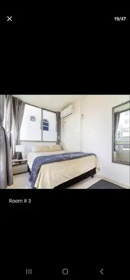 a small bedroom with a bed and a window at El Laguito Apartamento in Cartagena de Indias