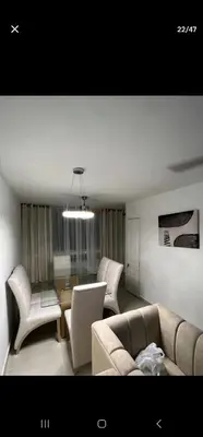 a living room with a couch and chairs at El Laguito Apartamento in Cartagena de Indias