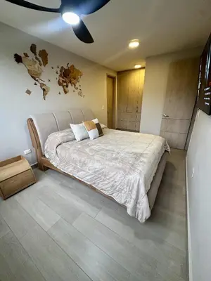 a bedroom with a large bed in a room at Luxury loft with home theater & pool, Buenavista top location in Barranquilla