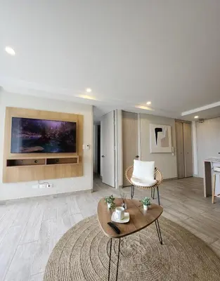 a living room with a couch and a coffee table at Dominique 609 Apartment with private jacuzzi in Cartagena de Indias