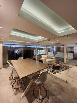 a dining room with a large wooden table and chairs at Dominique 609 Apartment with private jacuzzi in Cartagena de Indias