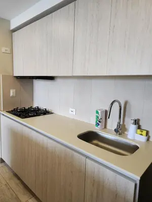 a kitchen with a sink and a stove at Dominique 609 Apartment with private jacuzzi in Cartagena de Indias
