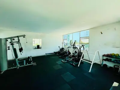 a gym with several exercise bikes in a room at Apartamento en Sabanilla in Puerto Colombia