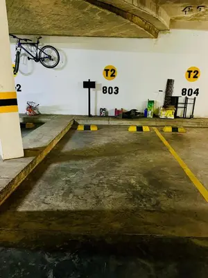 a bike hanging on the wall of a parking garage at Apartamento en Sabanilla in Puerto Colombia