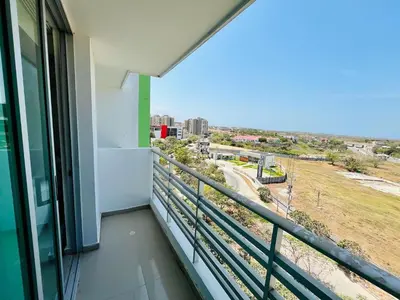 a balcony with a view of a city at Apartamento en Sabanilla in Puerto Colombia