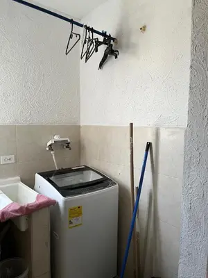 a light on the wall next to a refrigerator at Edificio K in Cartagena de Indias