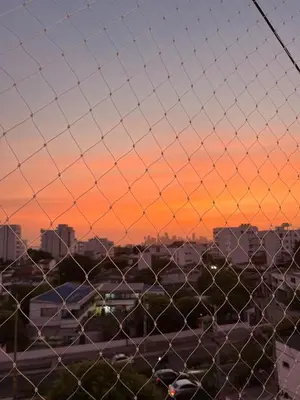 a fence with a view of a city at sunset at Edificio K in Cartagena de Indias